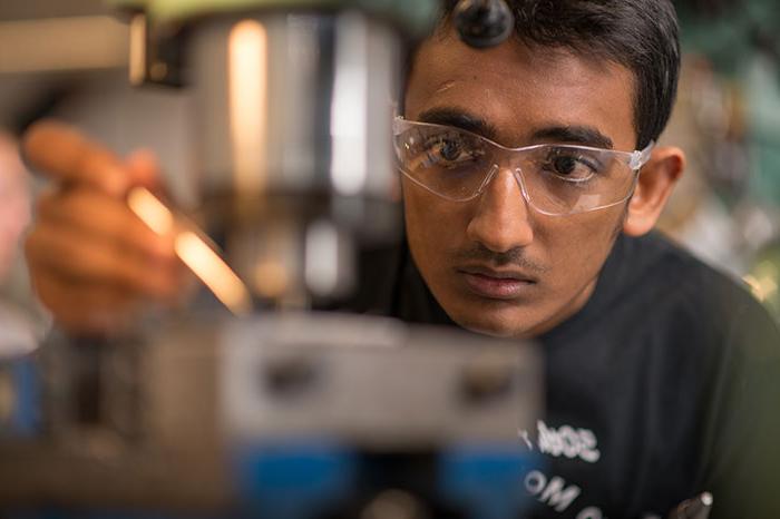 unh researcher in test lab